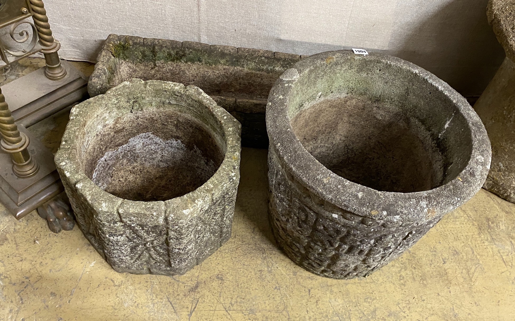 A Cotswold Studios rectangular reconstituted stone garden planter together with two circular planters, largest height 36cm